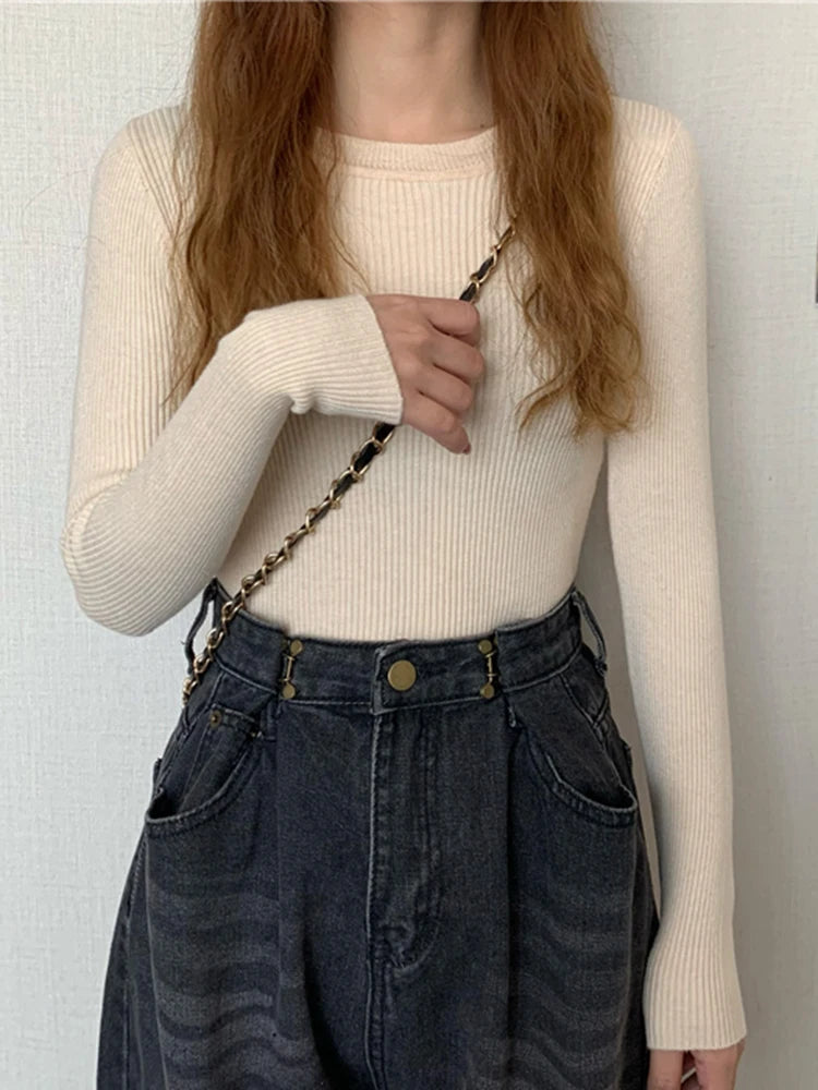 Nova blusa feminina 2025 para outono e inverno, manga longa, pulôver básico com pescoço elástico e estilo sólido em malha jumper.