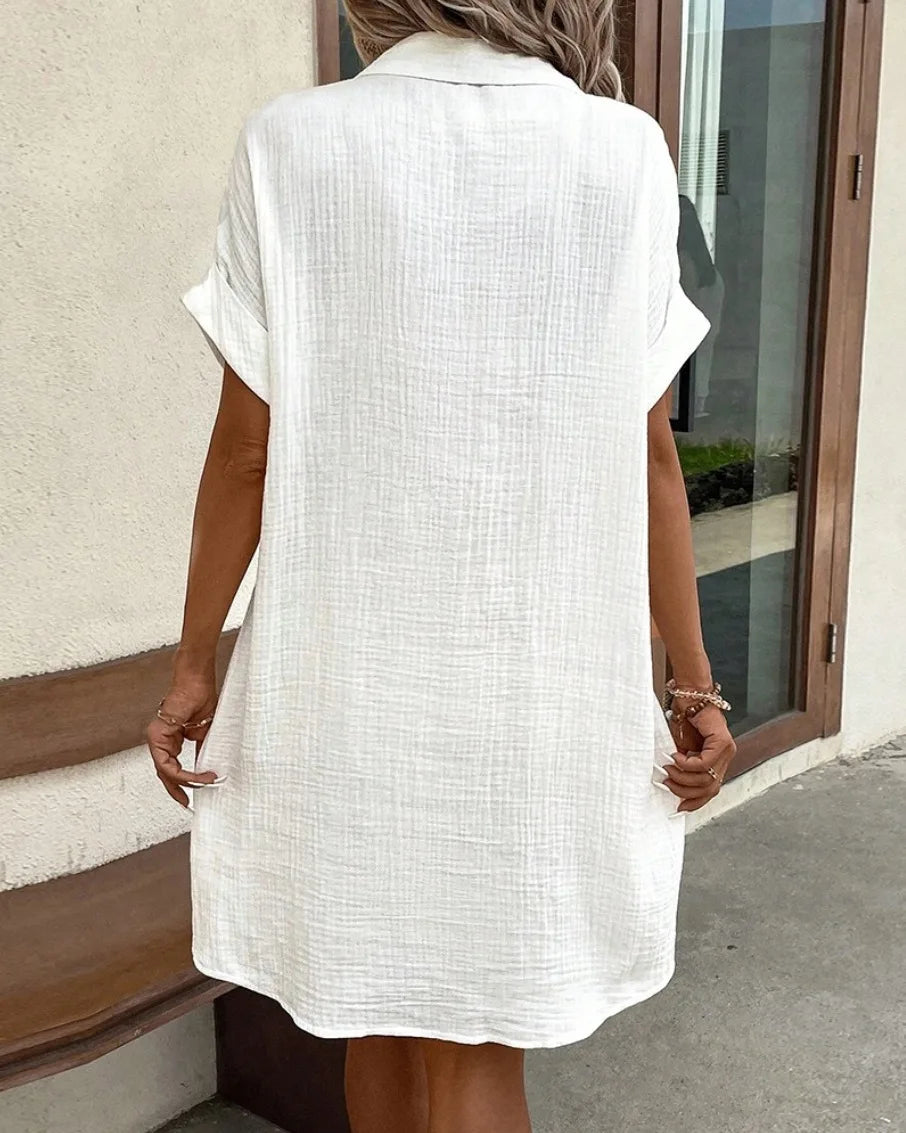 Vestido feminino de verão 2025, nova moda simples e sexy, com decote em V, botão único, mangas curtas e bolsos.