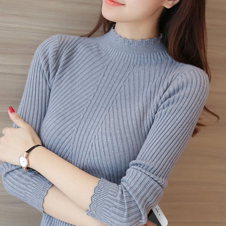 Aproveite a temporada de outono com estilo! A blusa feminina Eveisi apresenta um sofisticado mock neck e delicados babados, perfeita para compor looks casuais e elegantes.