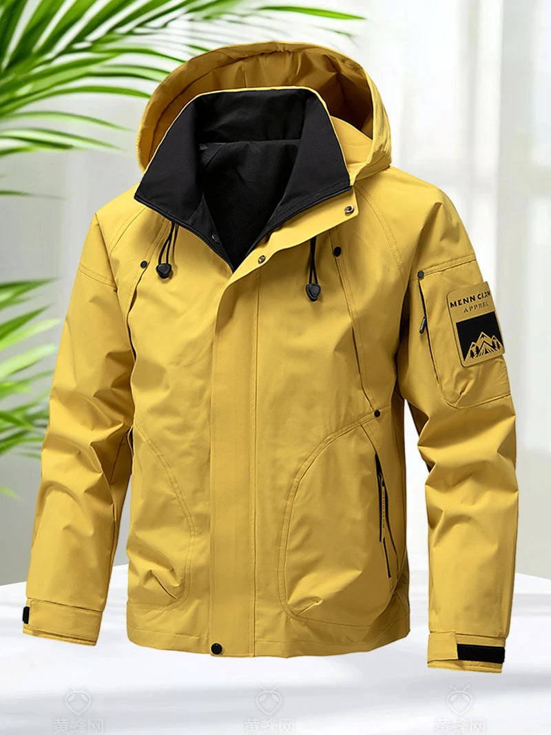 Jaqueta impermeável masculina para atividades ao ar livre, tipo softshell, com zíper e capuz. Ideal para caminhadas e acampamentos, é leve e perfeita para a primavera e outono.